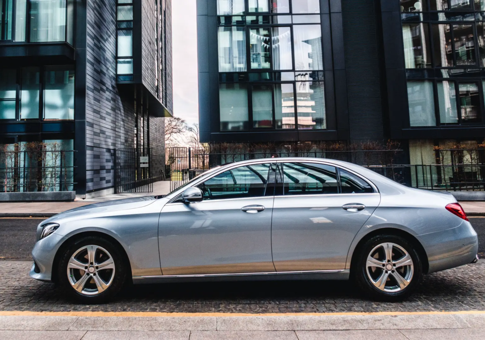 Reliable Executive Transfer - Silver Mercedes-Benz E-Class in Scotland Silver Mercedes-Benz E-Class prepared for executive and airport transfer services on Edinburgh's city streets.