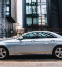 Silver Mercedes-Benz E-Class prepared for executive and airport transfer services on Edinburgh's city streets.