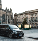 Black Mercedes V-Class parked near St Giles' Cathedral in Edinburgh, ready for executive transfers.