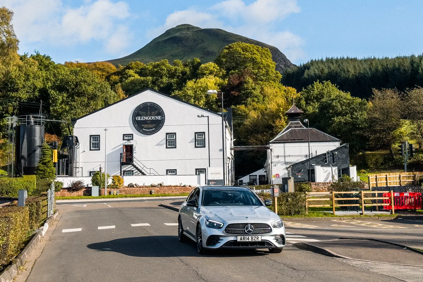 Scottish Tradition Meets Contemporary Travel Mercedes-Benz sedan at Glengoyne Distillery en route to St Andrews.