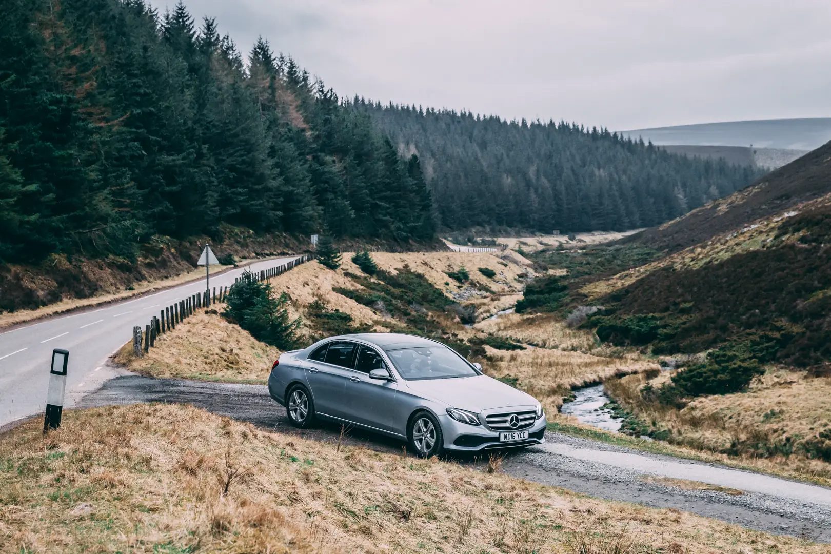 St Andrews Scenic Route Transfer - Mercedes-Benz E-Class Mercedes-Benz E-Class ready for the St Andrews scenic transfer on a remote Scottish road.
