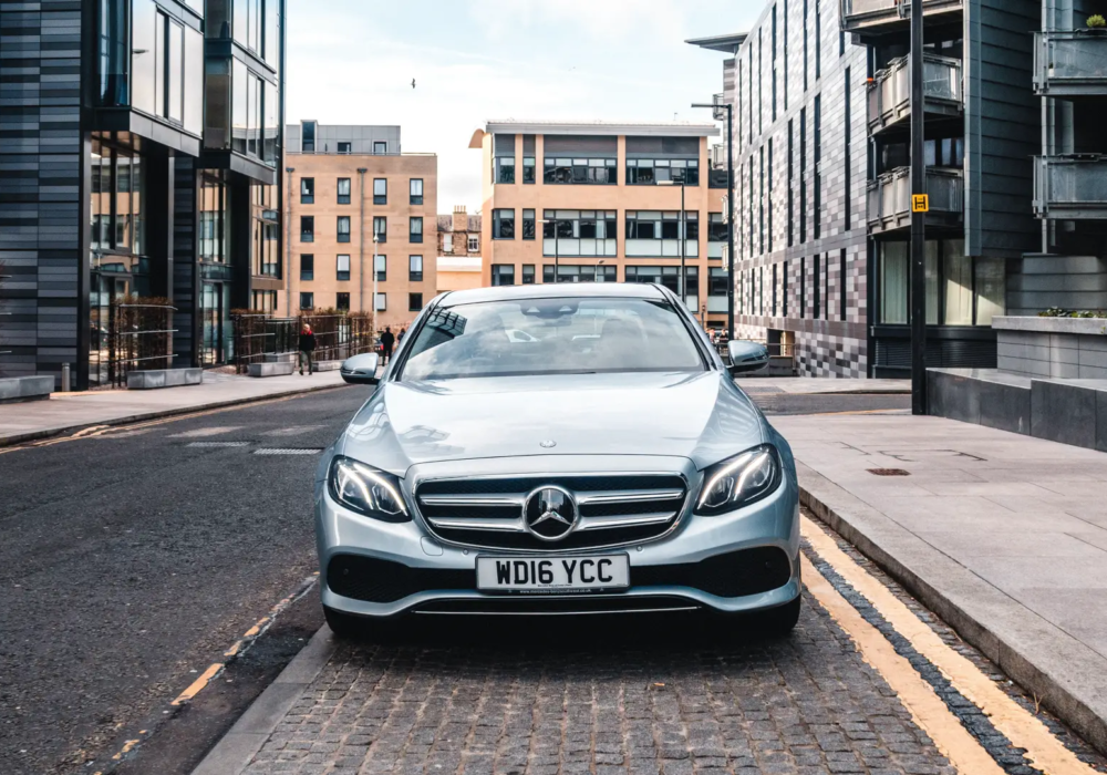 Streamlined City Transit – Mercedes-Benz E-Class for Efficient Journeys Silver Mercedes-Benz E-Class ready for executive and airport transfer services in the heart of Edinburgh.