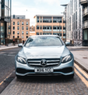 Silver Mercedes-Benz E-Class ready for executive and airport transfer services in the heart of Edinburgh.