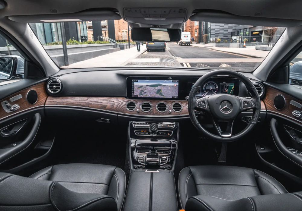 Executive Comfort and Navigation – Mercedes-Benz E-Class Interior of a Mercedes-Benz E-Class with navigation system, providing comfortable executive transfers in Scotland.