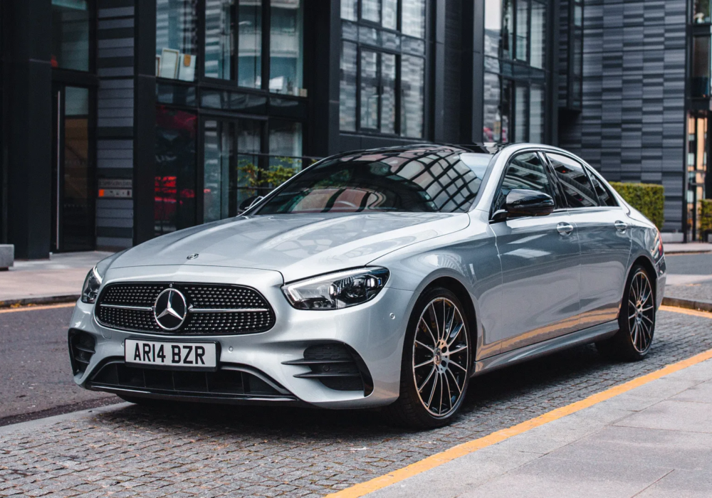 Silver Mercedes-Benz E-Class parked on the city street, ready for an executive transfer.