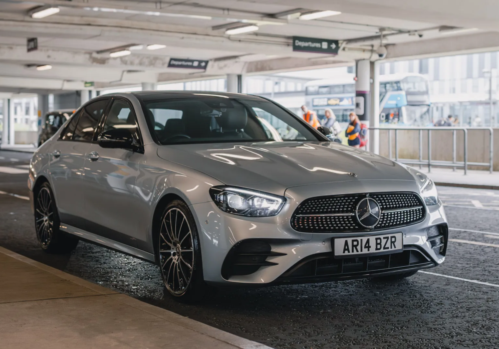 Silver Mercedes E-Class ready for airport transfer service.