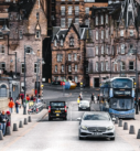 Silver Mercedes-Benz E-Class on an Edinburgh street, showcasing executive transfer services in the heart of the city.
