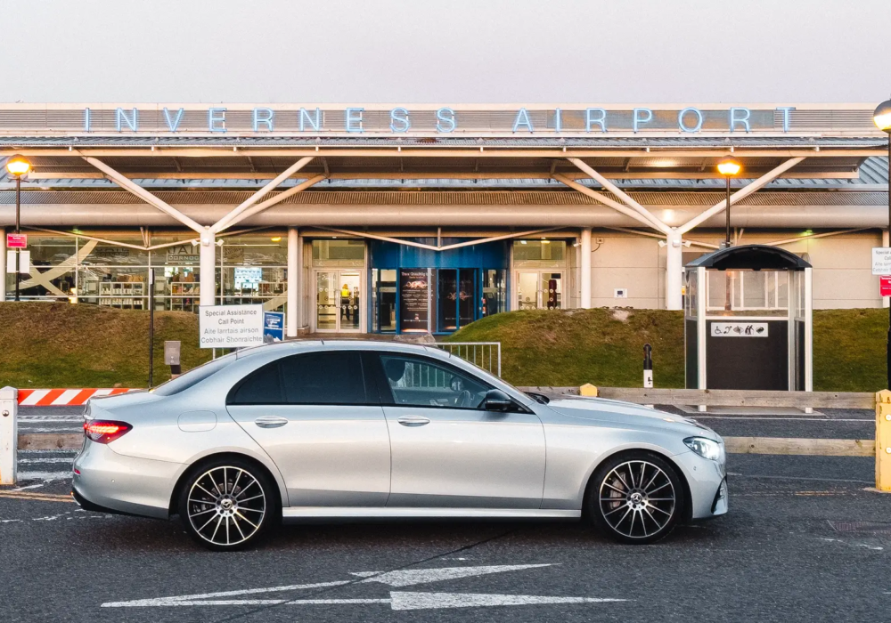 Mercedes E-Class at Inverness Airport ready for passenger transfer.