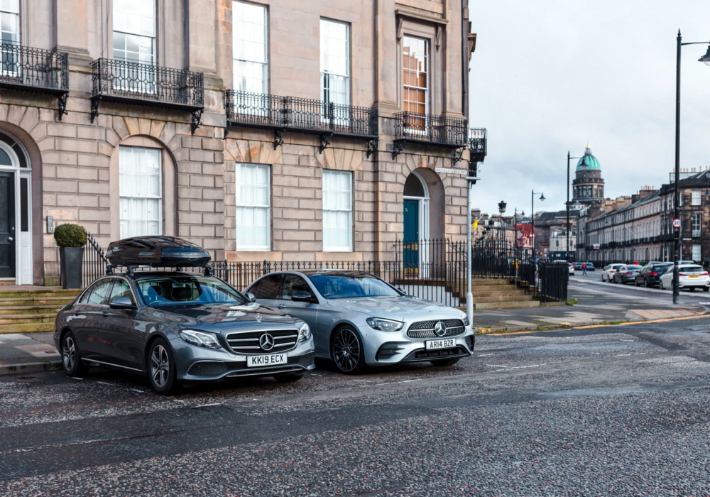 Grey and silver Mercedes vehicles ready for city transport, with added storage on one.