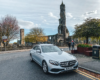 Mercedes-Benz E-Class on a historical tour, stopped by St Andrews Cathedral, ready for an Edinburgh to St Andrews shore transfer.