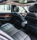 Interior of a Mercedes-Benz showing leather seats and navigation system, ready for executive transfers in Scotland.
