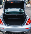 Silver Mercedes E-Class with open trunk, ready for hotel to airport transfers in Scotland.